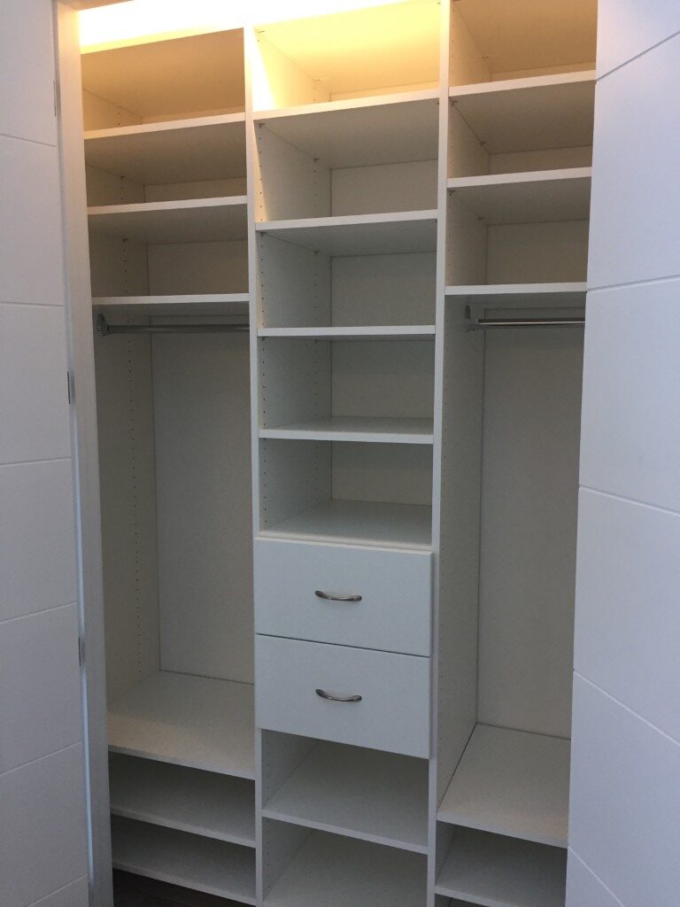 reach in in white finish closet design in ottawa